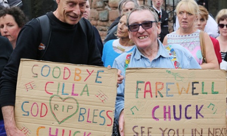 Fans of Cilla Black watch her funeral cortege pass in front of St Mary’s church.