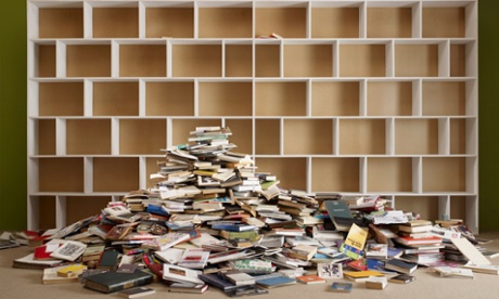 Empty bookcase with books on the floor