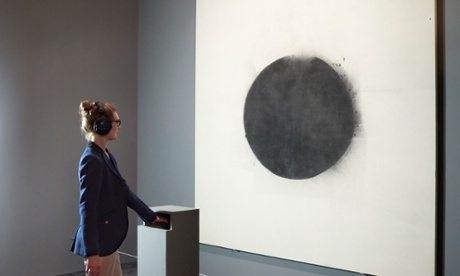 The haptic device in front of John Latham's painting Full Stop