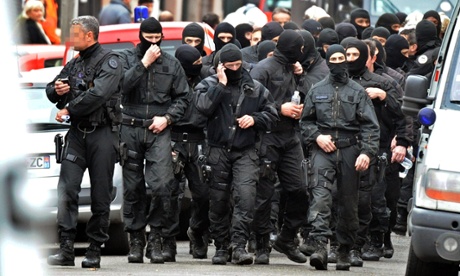 Members of the French special police forces unit after breaking into the besieged flat of al-Qaida militant Mohamed Merah in Toulouse in March 2012.