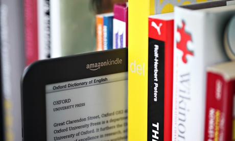 a kindle on a bookshelf