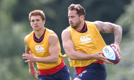 Danny Cipriani runs with the ball watched by Henry Slade during an England training session earlier this month