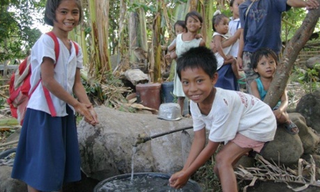 Children using the ram pump