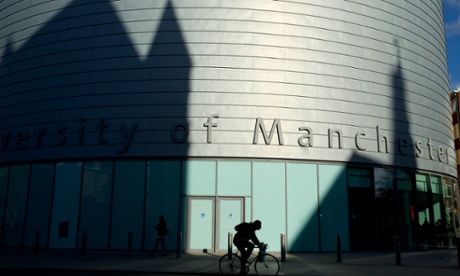 A student cycling at the University of Manchester.