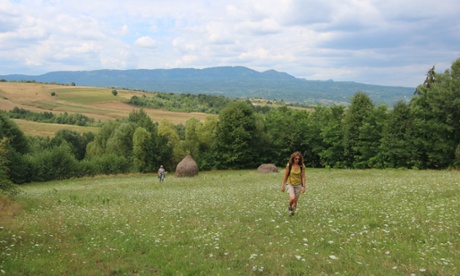 Meadow lark … Sophie and Maddy walk by stooks in a field near Breb.