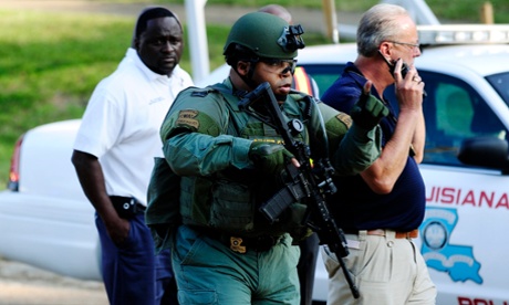 A Swat officer in Sunset, Louisiana, during the pursuit of a man who stabbed three people and shot a police officer.