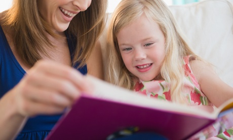 Mother and daughter reading book together