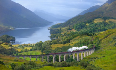 The Jacobite Steam Train, better known now as the Harry Potter Train, crossing the Glenfinnan Viaduct with Loch Shiel in the background.