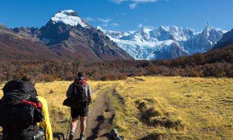 Tourists hiking on a path towards Los Cuernos 
