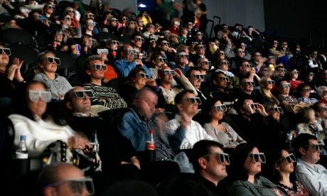 An audience wearing 3D glasses at the London BFI IMAX cinema