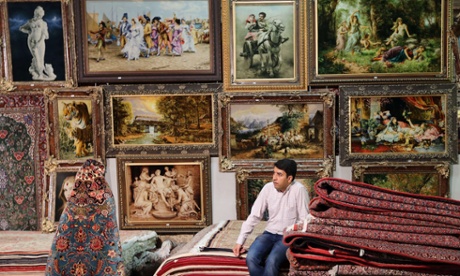 An Iranian vendor waits for clients at Iran's international hand-woven carpet exhibition in Tehran.