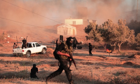 Palestinian fighters simulating an attack on Israel during a graduation ceremony on 27 August 2015.