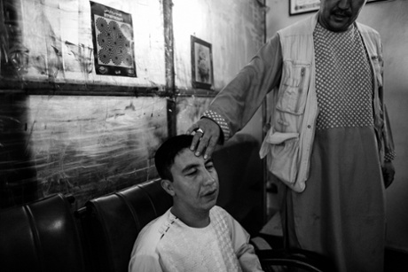 Arab Shah with one of the many people who visit him for guidance.