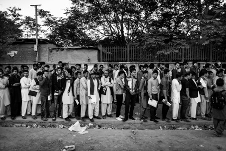 Every weekday morning hundreds queue in front of the passport office in Kabul