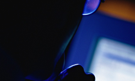Man looking at computer screen from behindGetty Images