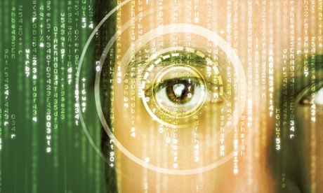 A man looking at a wall of data