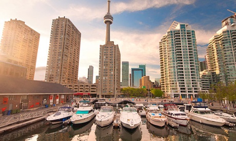 The new Harbourfront development in Toronto with boats against a backdrop of the city skyline