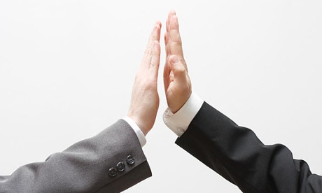 two businessmen doing high five