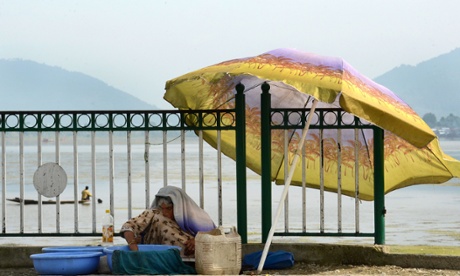 A fish vendor beside Dal Lake in Srinagar, the summer capital of the Indian state of Jammu and Kashmir. 