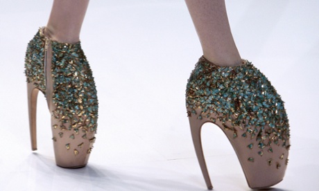 A model presents an outfit by British designer Alexander McQueen