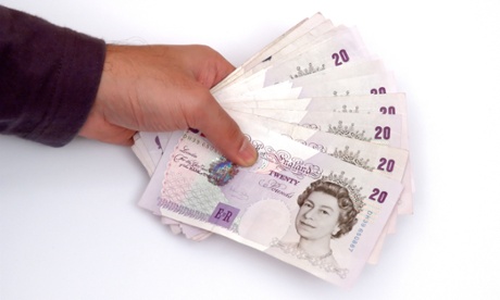 twenty pounds notes in hand