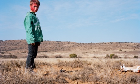 Bloodied hunter # IV with buck, South Africa, by David Chancellor. 