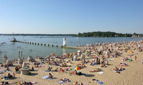 Swimmers and sunbathers at the Strandbad Wannsee, Berlin.