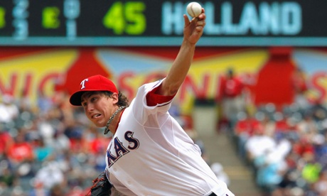 Derek Holland’s impersonation of Arnold Schwarzenegger is even better than his fastball. Holland is currently rehabbing from a shoulder injury and hopes to return later in August.