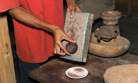 Farm worker grating cocoa, Baracoa, Cuba