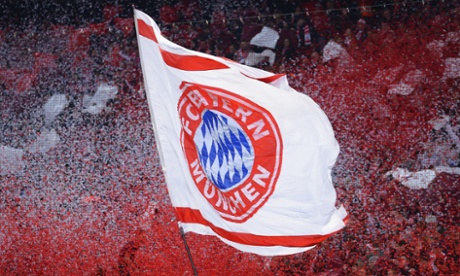 Fans wave a Bayern Muenchen flag during the UEFA Champions League Quarter Final