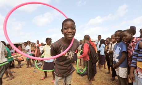 Children play with hula hoops in Chiputo, eastern Mozambique as part of an International Inspiration programme delivered by Unicef.