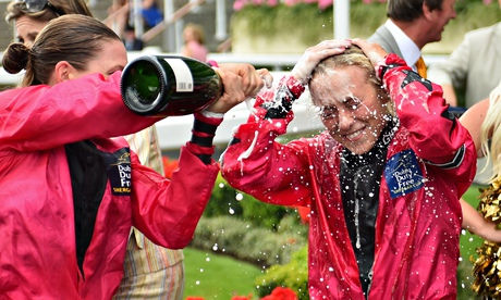 Sammy Jo Bell is sprayed with champagne by her captain Emma-Jayne Wilson as they celebrate at Ascot
