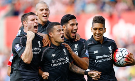 Philippe Coutinho, centre, is mobbed by his Liverpool team-mates after his brilliant late winner put paid to Stoke City.