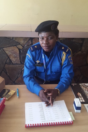A policewoman assists data capture for the census.