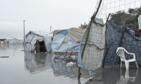 Tents sitting in the flood waters in the Jungle.