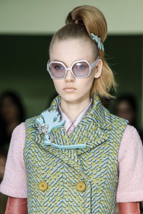 At brooch at the Prada show