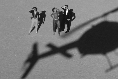 The glamorous world of Von Wangenheim comes with the accessories of the super-rich - such as a helicopter, in shadow in this image, featuring Gia Carangi for Vogue in 1979.