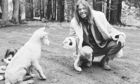 Musician Neil Young offers his dog a cigarette.