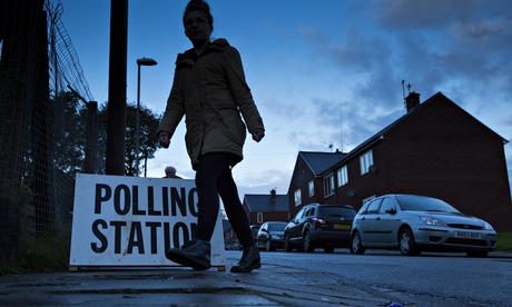 young woman walking by polling station