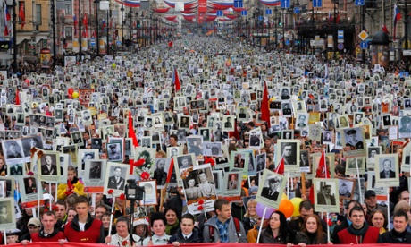 Local residents carry portraits of the their relatives who participated in world war two, as they celebrate Victory Day in St Petersburg in May.