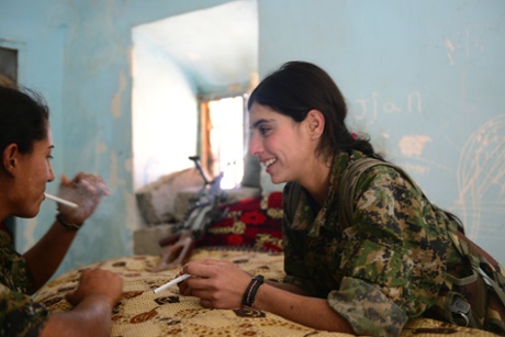 Rosa, 21, and Rajbin, 19, take a break. One of the fighters' most cherished freedoms is to smoke.