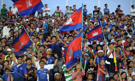 Cambodian fans wave the national flag during the  match between Cambodia and Syria. 