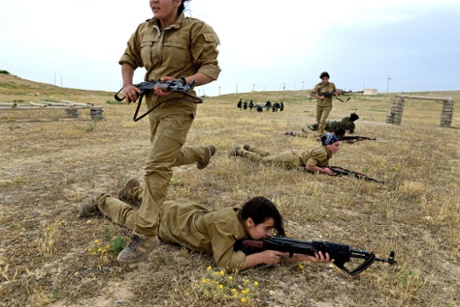 Yazidi girls take part in a military training session organised by the Kurdish Women’s Protection Unit (YPJ) in the Sinjar region of Iraq. All photographs by Alfred Yaghobzadeh.