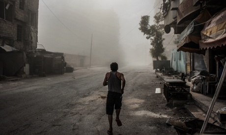 A man flees shelling in Damascus, Syria, August 2015.