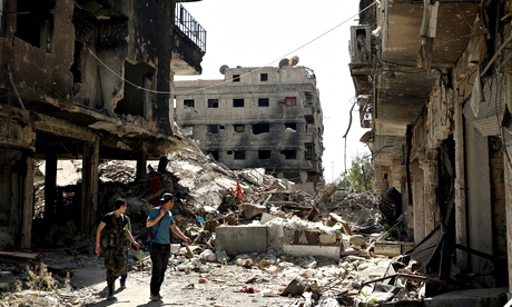 Soldiers patrol the ruins of Yarmouk refugee camp, once a bustling suburb of Damascus.