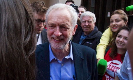 Jeremy Corbyn, the new leader of Britain's opposition Labour Party greets supporters after speaking in a pub.
