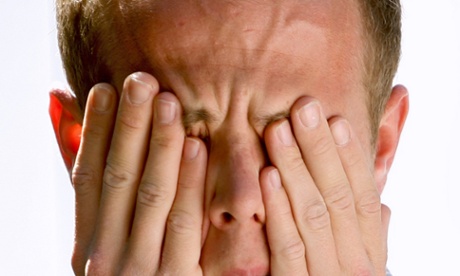 Man rubbing eyes