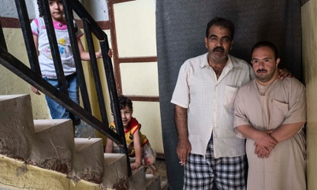 Mahmoud Krouma, his brother-in-law Mazin and two of his children in Mafraq.