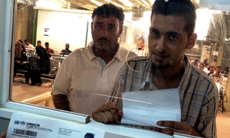 Refugees queue at the main UNHCR registration centre in Amman, many attracted by rumours of UN help to resettle in Europe
