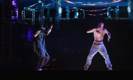 Snoop Dogg raps with a hologram of Tupac at Coachella in 2012.